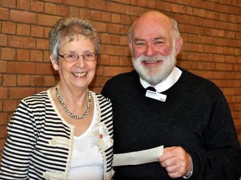 Gillian presents the cheque to Alan Wilcher of Parkinsons UK